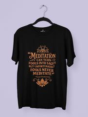 Black t-shirt with orange text and lotus design on a hanger against a light purple background