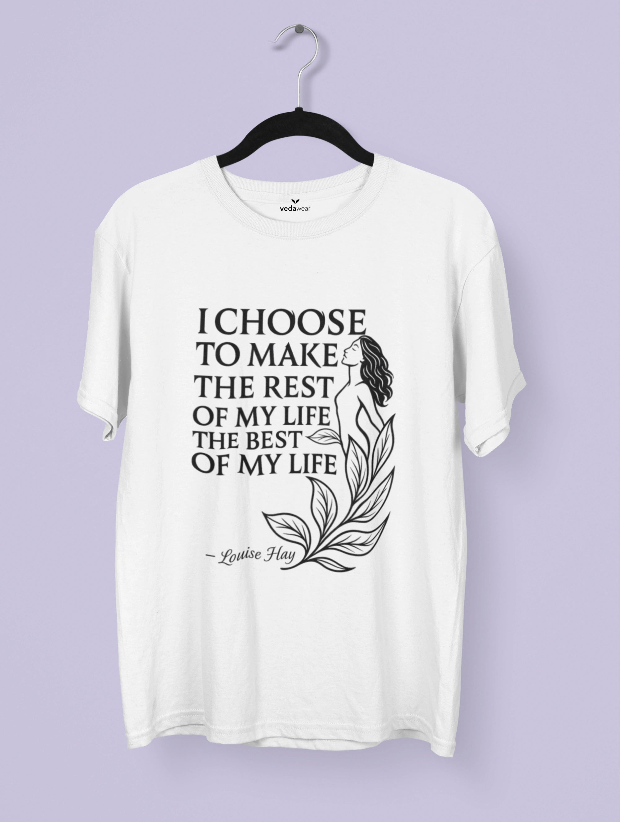 White t-shirt with motivational quote on a hanger against a light purple background