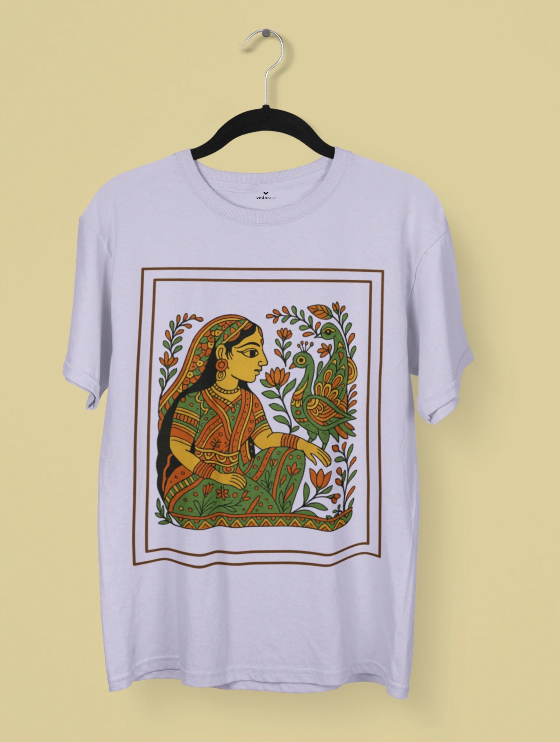 Graceful Harmony Madhubani Art Premium Tee by Vedawear featuring a traditional Mithila folk painting of an Indian woman with peacocks and lotus motifs on premium cotton.