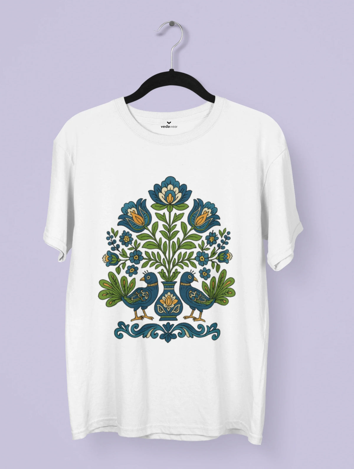 Hungarian folk art inspired premium cotton tee by Vedawear featuring bluebirds and floral motifs in indigo, green, and golden hues