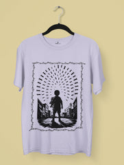 Innocence Under Fire – Anti-War Premium Tee by Vedawear, black silhouette of child under falling bombs framed in barbed wire, DTG printed on Supima cotton