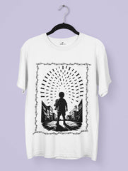 Innocence Under Fire – Anti-War Premium Tee by Vedawear, black silhouette of child under falling bombs framed in barbed wire, DTG printed on Supima cotton