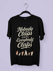 premium T-shirt with “Nobody Claps Until Everybody Claps” quote and diverse hands clapping – unity-themed Vedawear design.
