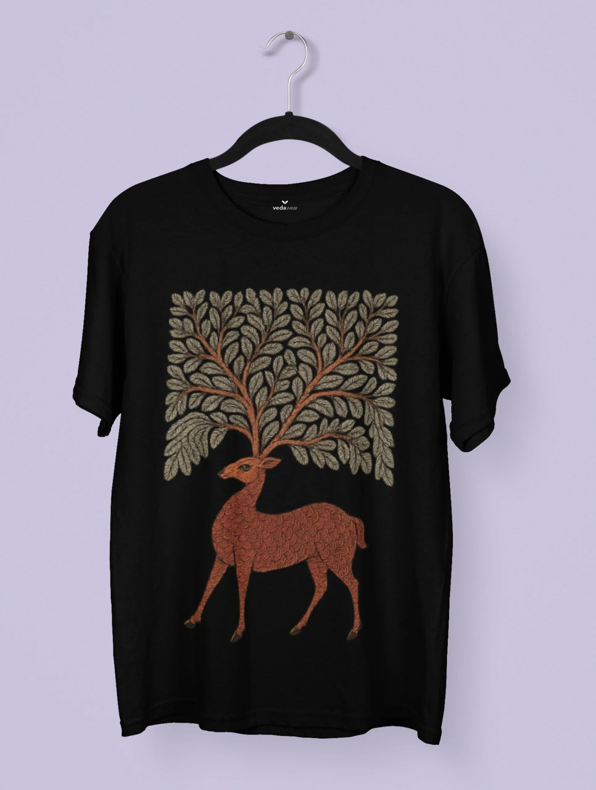 Gond tribal art–inspired deer with foliage antlers printed on a white Vedawear premium cotton T-shirt