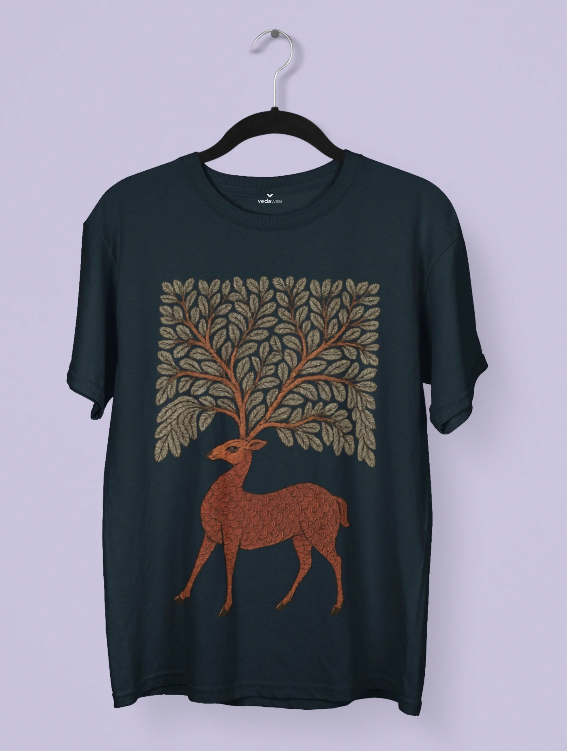 Gond tribal art–inspired deer with foliage antlers printed on a white Vedawear premium cotton T-shirt