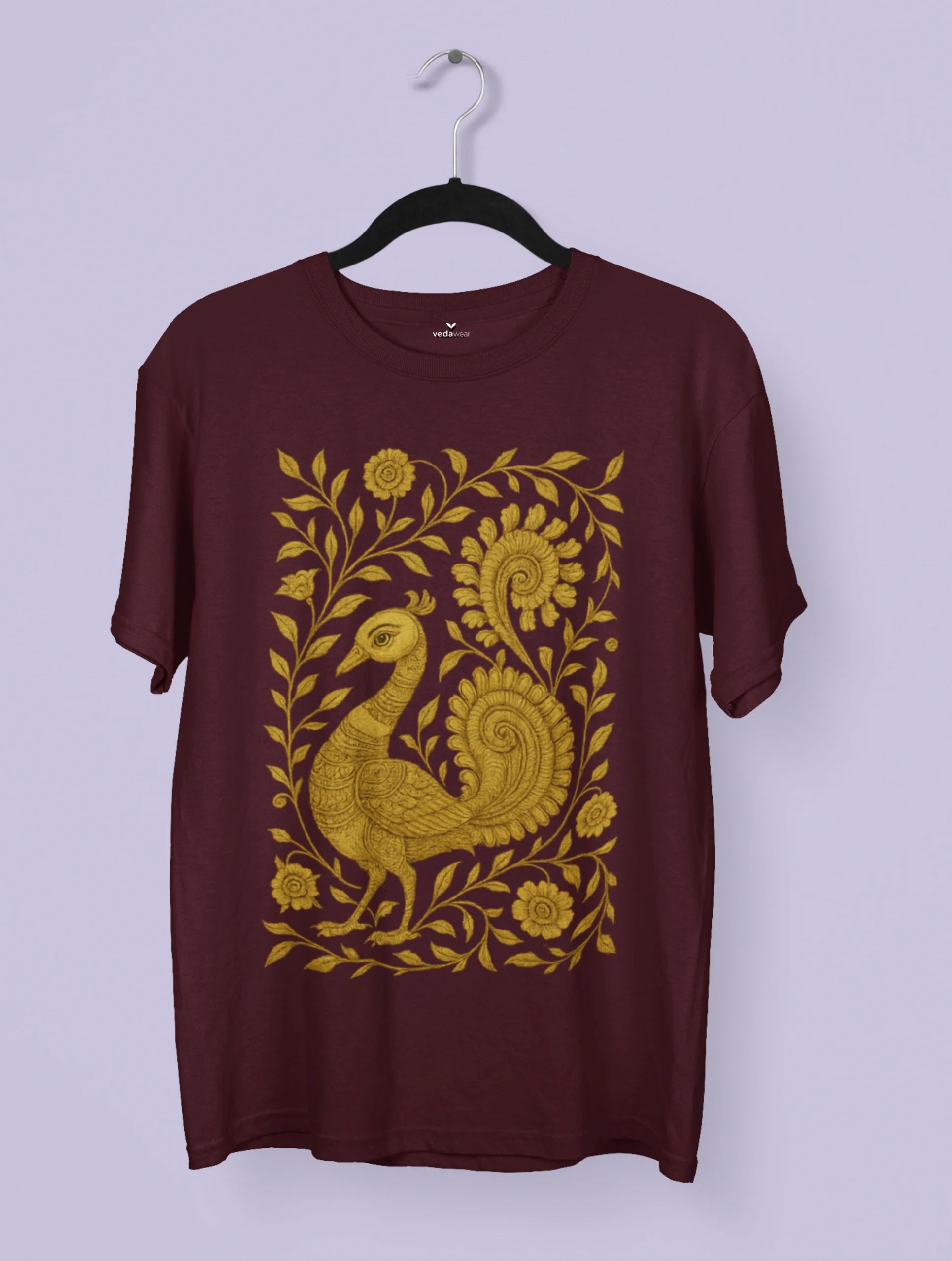 Timeless Grace – Kalamkari Folk Art Premium Tee by Vedawear featuring a golden peacock with intricate floral motifs, inspired by traditional Indian Kalamkari design, printed on premium cotton.