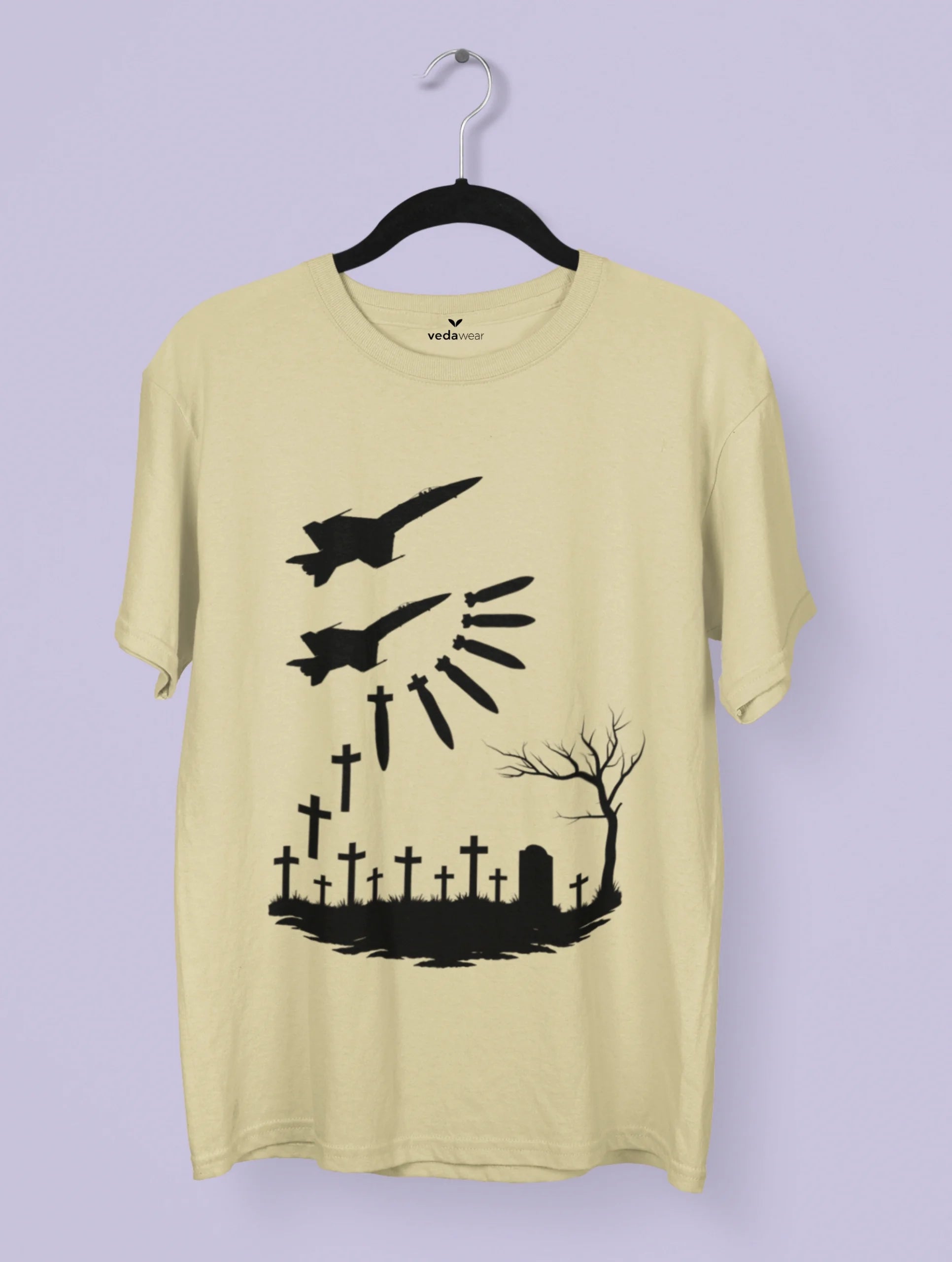 Vedawear War & Silence Artistic Premium Tee featuring two fighter jets dropping bombs that transform into crosses above a graveyard scene, anti-war monochrome design on white cotton T-shirt.